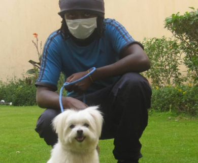 gabriel-gitau-mobile-dog-wash-kenya-holding-white-terrier